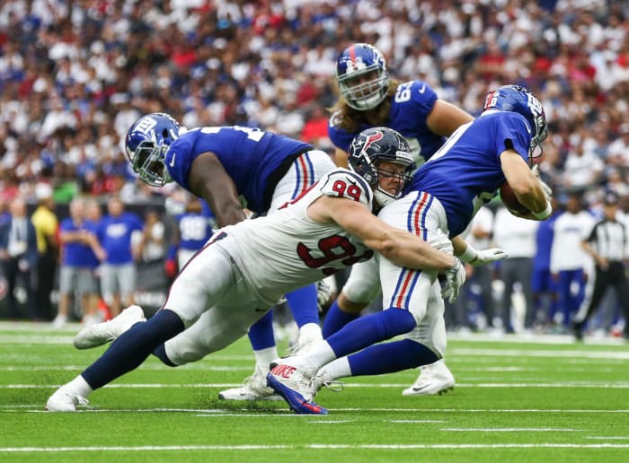 Houston Texans defensive end J.J. Watt dives to sack Eli Manning